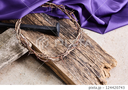 Easter background depicting the crucifixion with a rustic wooden cross, crown of thorns and nails. Easter background depicting the crucifixion with a rustic wooden cross, crown of thorns and nails. 124420743