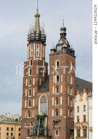 Historical church towers in Krakow captured in clear daylight. The medieval architecture Historical church towers in Krakow captured in clear daylight. The medieval architecture 124422624