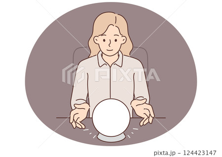 Woman uses crystal ball to predict future during seance and provide psychic services Woman uses crystal ball to predict future during seance and provide psychic services 124423147