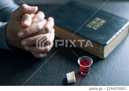 Holy Communion or Eucharist of christianity concept. Eucharist is sacrament instituted by Jesus. during last supper with disciples. Bread and wine is body and blood of Jesus Christ of Christians. 124425063