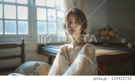 レースのドレスを纏った女性のポートレート（美容・コスメ・自然光：AI生成） 124425732