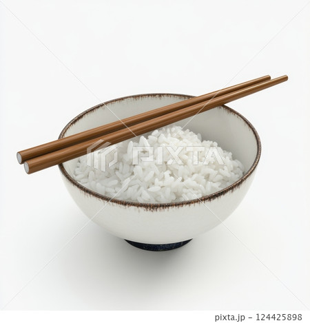 A bowl of white rice with chopsticks in it 124425898