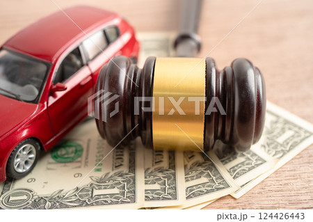 Hammer gavel judge and Euro banknote money with car vehicle accident, insurance coverage claim lawsuit court case. Hammer gavel judge and Euro banknote money with car vehicle accident, insurance coverage claim lawsuit court case. 124426443