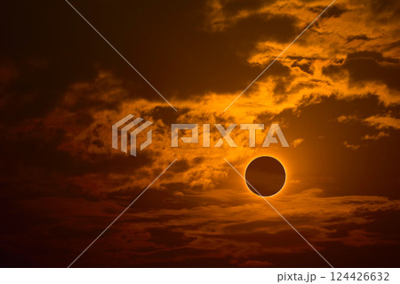 eclipse on the gold sunset sky and transparent cloud 124426632