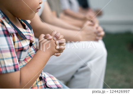 Christian woman held hands with the group, expressing their faith through prayer and devotion to God, uniting in their shared religion. Friends, Group christian pray concept. Christian woman held hands with the group, expressing their faith through prayer and devotion to God, uniting in their shared religion. Friends, Group christian pray concept. 124426997