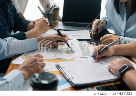 Financial analyst presented a detailed data analysis graph to their colleague, corporate office, demonstrating the business's financial status and trends. Concept of business data analysis. 124427322