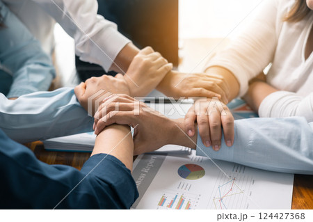 Professional businessman led the team meeting, In the corporate office, emphasizing the importance of teamwork in their business work alongside his colleagues. Business teamwork concept. 124427368