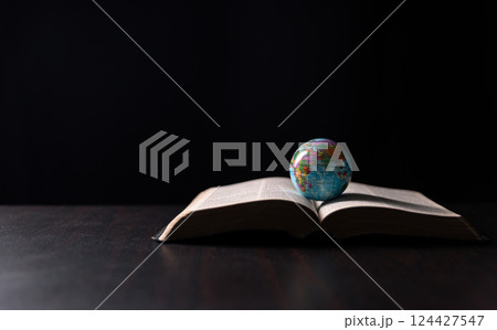 Missionary embarked on mission across the earth, armed with faith in Jesus Christ and a map, spreading the teachings of Christianity and the Bible to fulfill God's call within the Christian religion. Missionary embarked on mission across the earth, armed with faith in Jesus Christ and a map, spreading the teachings of Christianity and the Bible to fulfill God's call within the Christian religion. 124427547