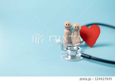 Concept of comprehensive health care includes medical professionals using stethoscopes to diagnose diseases, while health insurance ensures patients can access the necessary medicine and care. 124427645