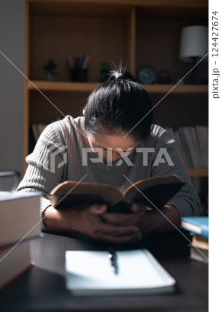 Woman with Bible in her hand, faith in God strengthened by holy words of book, found solace and inspiration through prayer in her Christian religion. bible, woman, book, religion, christian, holy. Woman with Bible in her hand, faith in God strengthened by holy words of book, found solace and inspiration through prayer in her Christian religion. bible, woman, book, religion, christian, holy. 124427674