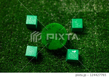 Wooden cube symbolizing renewable energy, sustainable practices sits concept piece for green, eco-friendly future on Earth, promoting environmental, ecological awareness. eco, renewable, sustainable 124427765
