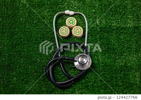 Wooden cube symbolizing renewable energy, sustainable practices sits concept piece for green, eco-friendly future on Earth, promoting environmental, ecological awareness. eco, renewable, sustainable 124427766