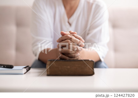Christian woman with faith and hope, raises her hand in worship to pray to God and Jesus Christ, embodying her religion. woman, hand, faith, pray, worship, jesus christ, christian, god, hope. Christian woman with faith and hope, raises her hand in worship to pray to God and Jesus Christ, embodying her religion. woman, hand, faith, pray, worship, jesus christ, christian, god, hope. 124427820