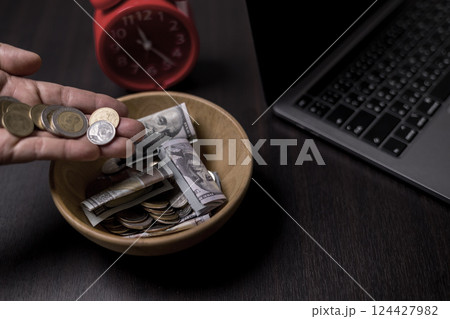 She felt deep sense of fulfillment when donating money to church, placing her tithe of coins and cash into offering bowl, knowing her giving would help fund important causes. donating, money, tithe. She felt deep sense of fulfillment when donating money to church, placing her tithe of coins and cash into offering bowl, knowing her giving would help fund important causes. donating, money, tithe. 124427982