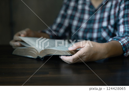 Christian congregation gathered at church, each hand holding Bible, Unwavering faith, prayer and hope, seeking guidance of God through holy prayers. believers to worship, faith in Jesus Christ. Christian congregation gathered at church, each hand holding Bible, Unwavering faith, prayer and hope, seeking guidance of God through holy prayers. believers to worship, faith in Jesus Christ. 124428065