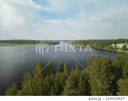 A Beautiful Serene Lakeside View that is Surrounded by Lush and Vibrant Greenery all Around A Beautiful Serene Lakeside View that is Surrounded by Lush and Vibrant Greenery all Around 124429827