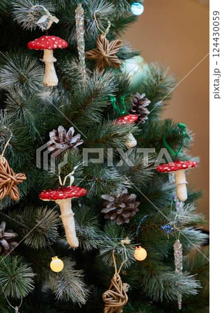 Whimsical Christmas Tree Decor Featuring Charming Fun Mushrooms and Lovely Natural Elements 124430059