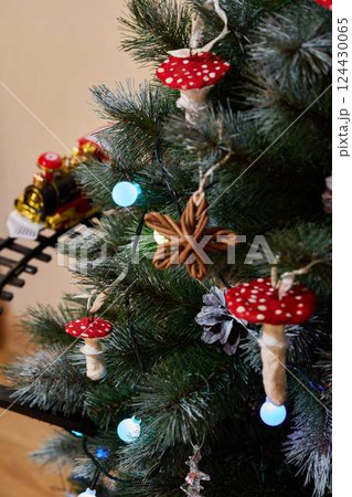 Enjoy a festive Christmas Tree this year with unique mushroom decorations for a whimsical touch 124430065