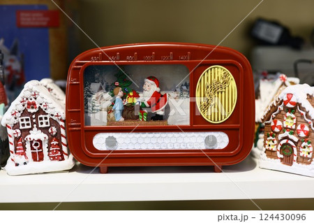 Charming Vintage Christmas Radio featuring a delightful scene with Santa and a Snowman figurine 124430096