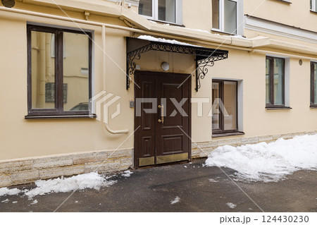 An Elegant Entrance to a Beautiful Residential Building Surrounded by Lovely Snowy Landscapes 124430230