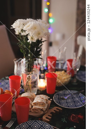 Enjoy a Festive Table Setting Complete with Beautiful Decor and Tasty Refreshments 124430244