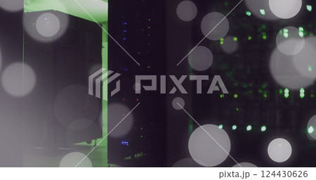 Image of spots of light and data processing over computer servers 124430626