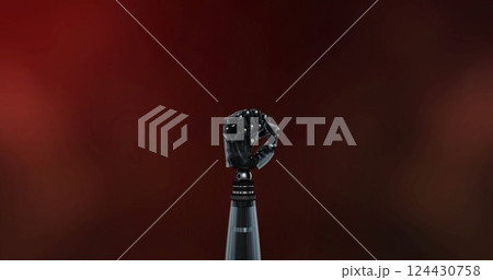 Robotic arm with clenched fist over red circuit board brain image Robotic arm with clenched fist over red circuit board brain image 124430758