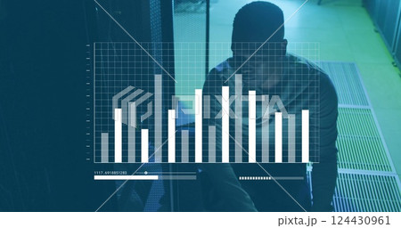 Image of financial data processing over african american businessman working in server room 124430961