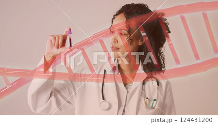 Image of dna strand over african american female doctor holding vial 124431200