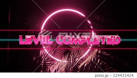 Level completed text image over neon circle and palm leaves 124431424