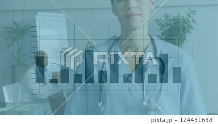 Medical data charts image over smiling healthcare professional in hospital Medical data charts image over smiling healthcare professional in hospital 124431638