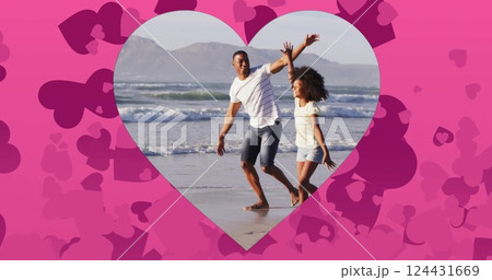 Couple running on beach, surrounded by heart shapes image Couple running on beach, surrounded by heart shapes image 124431669
