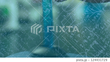 Image of mathematical equations over test tube in lab 124431729