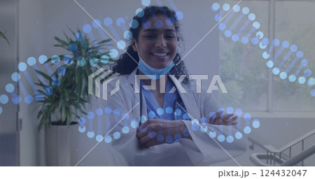 Image of dna strands over biracial female doctor with face mask Image of dna strands over biracial female doctor with face mask 124432047
