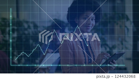 Image of financial data processing over african american businesswoman using tablet in office 124432068