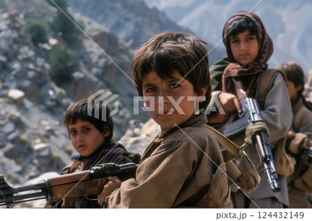 Group of determined young boys in mountains ready for combat with rifles 124432149