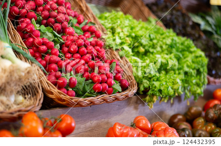 Assortment of freshly harvested organic vegetables showcased on display in supermarket 124432395