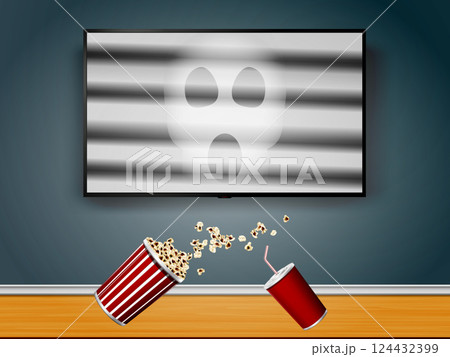 Popcorn and cola dropped from hands during a scared while watching a horror movie Popcorn and cola dropped from hands during a scared while watching a horror movie 124432399