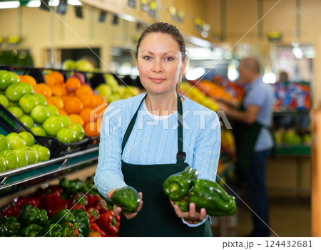 female seller selling peppers female seller selling peppers 124432681