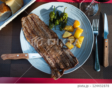 Roasted beef steak with potatoes and peppers Roasted beef steak with potatoes and peppers 124432878