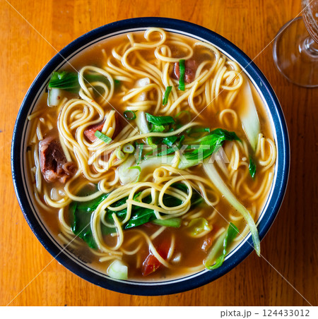 Soup with pasta and boiled beef tenderloin is traditional Chinese cuisine dish Soup with pasta and boiled beef tenderloin is traditional Chinese cuisine dish 124433012