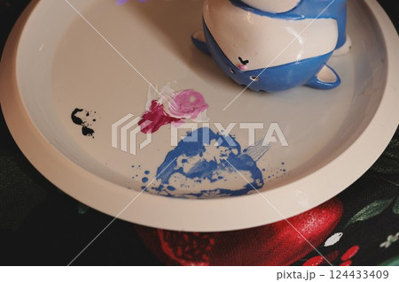 Whimsical Art Displayed on a Beautiful Plate Made with Colorful and Unique Ceramics 124433409