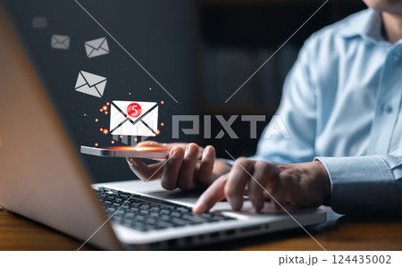 New email notification concept for business e-mail communication and digital marketing. Email marketing concept, person reading e-mail on smartphone, receive new message. newsletter online. 124435002