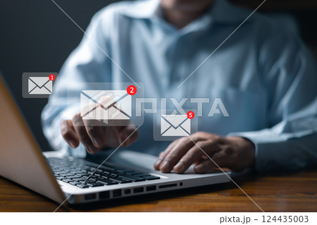 Email marketing concept, person reading e-mail on laptop computer, receive new message. New email notification concept for business e-mail communication and digital marketing. newsletter online. 124435003