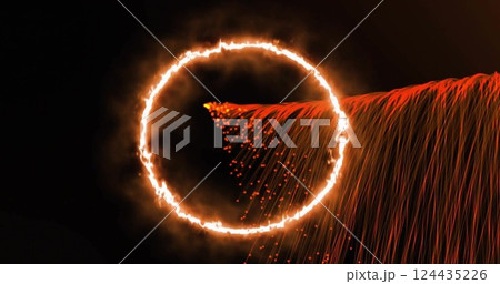 Image of orange light circle and flows moving on black background 124435226