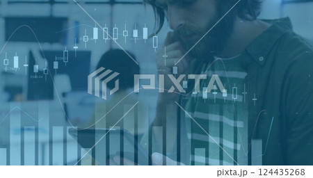 Image of financial data processing over caucasian businessman using tablet in office Image of financial data processing over caucasian businessman using tablet in office 124435268