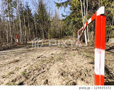 An open barrier in the forest in spring. Open barrier in the forest 124435372