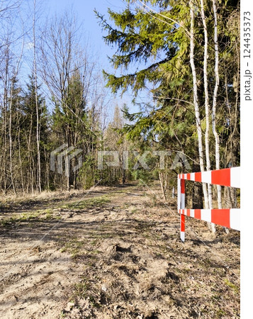 An open barrier in the forest in spring. Open barrier in the forest 124435373