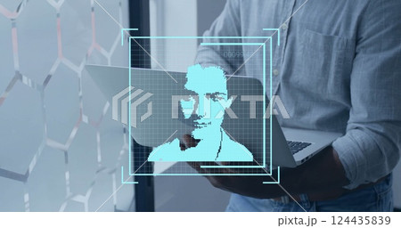 Image of data processing and people icons over biracial businessman using laptop in office Image of data processing and people icons over biracial businessman using laptop in office 124435839