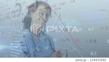 Image of data processing over smiling biracial female doctor 124435892